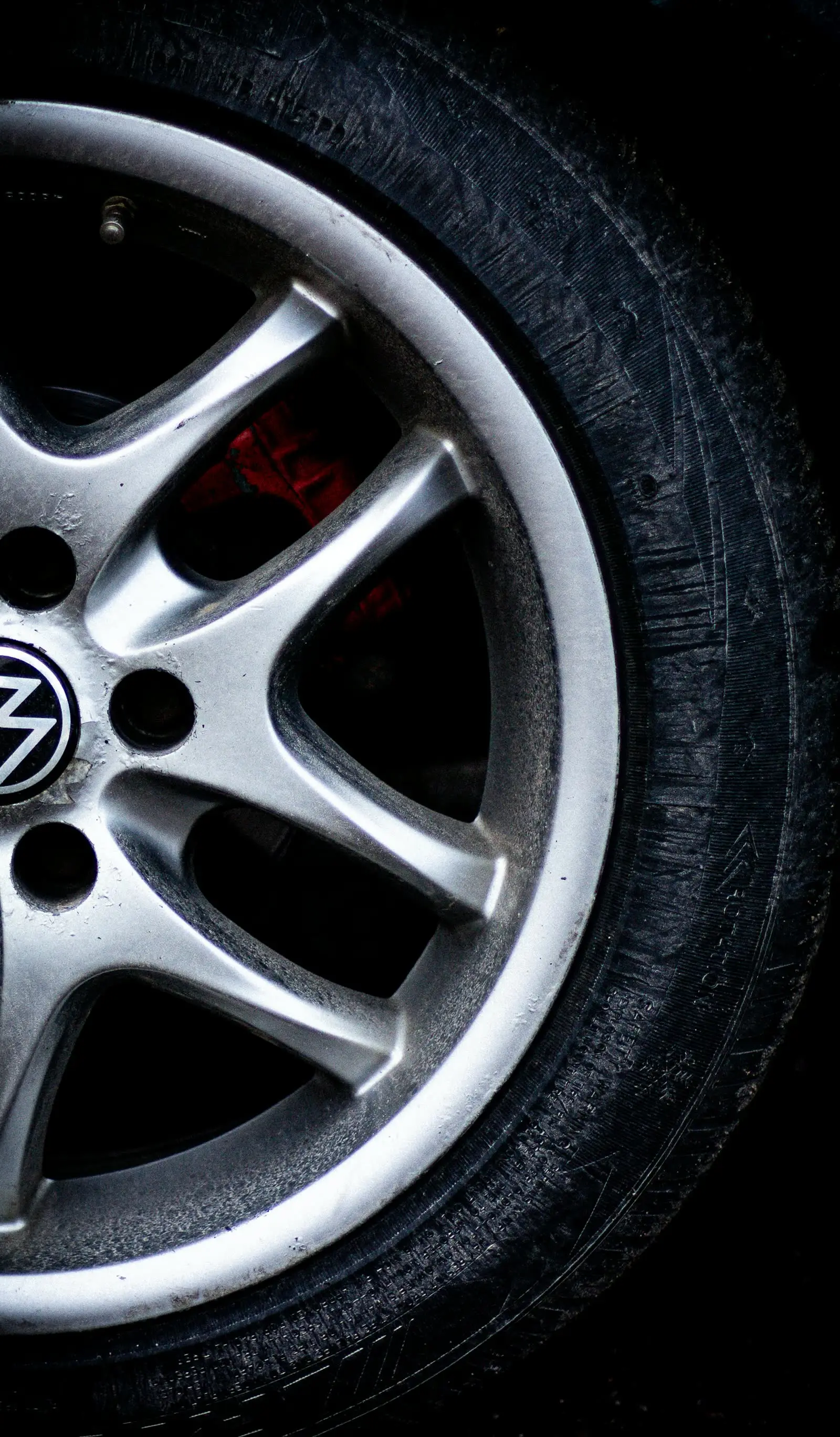 a close up of a tire on a car a close up of a tire on a car